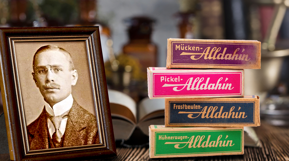 Neben vier übereinander gestapelten Vintage-Kisten mit der deutschen Aufschrift „Alldahín“, die sich in Farbe und Verwendungszweck unterscheiden, ist ein sepiafarbenes Porträt eines Mannes im Anzug zu sehen. Der Hintergrund ist unscharf.
